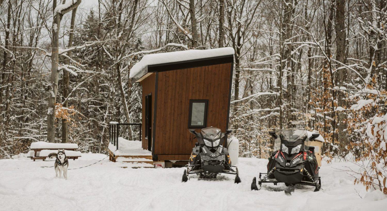 Snowmobiles Next to Tiny House - Sage by Cabinscape